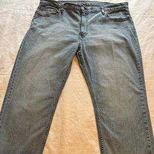Vintage pair of Levi 505 regular fit straight leg jeans in light blue wash.